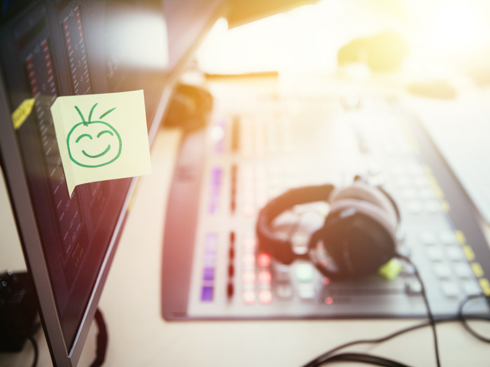 Feedback and motivation concept: Smiley Illustration at the working place, radio studio